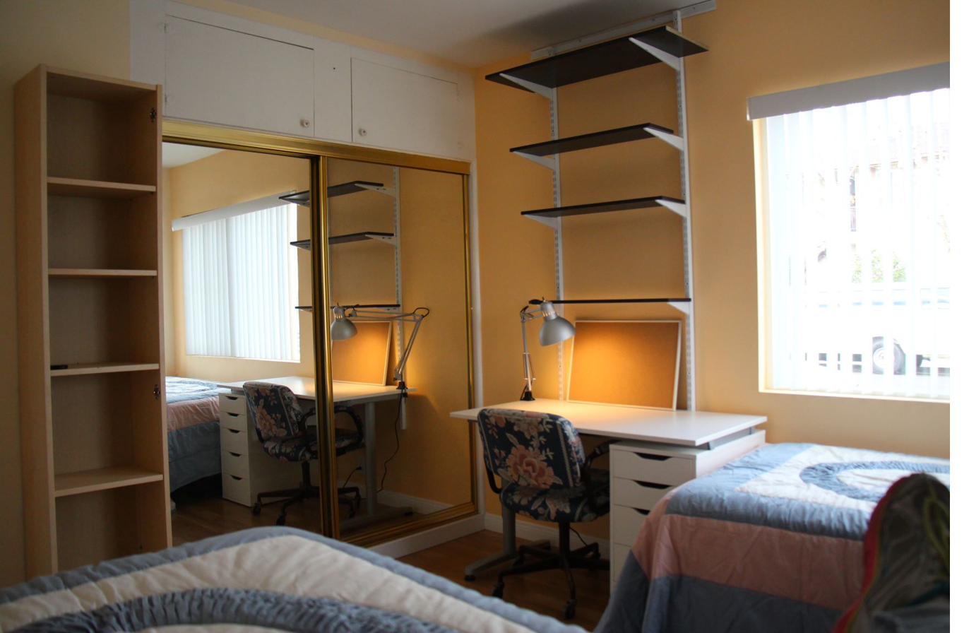 Student bedroom desk chair cork board closet storage near Cal State LA